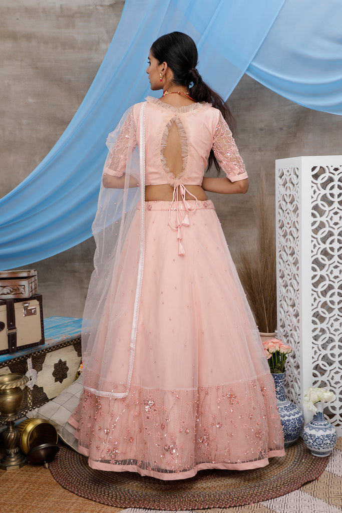 Peach Thread And Sequence Embroidered With All Over Pearl Rivet Stud Pasting Net Semi Stitched Bridal Lehenga ClothsVilla