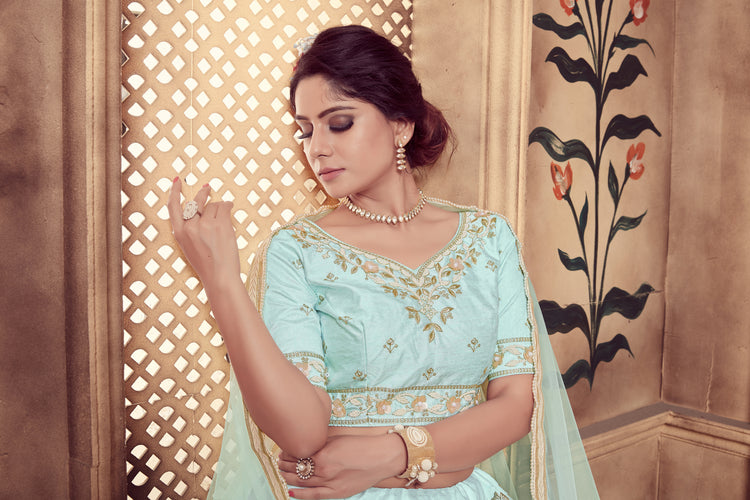 Stunning pastel blue lehenga with dazzling gold jewellery. See more on  wedmegood.com #wedmegood #indianwe… | Bridal makeup looks, Indian bride,  Bridal makeup artist