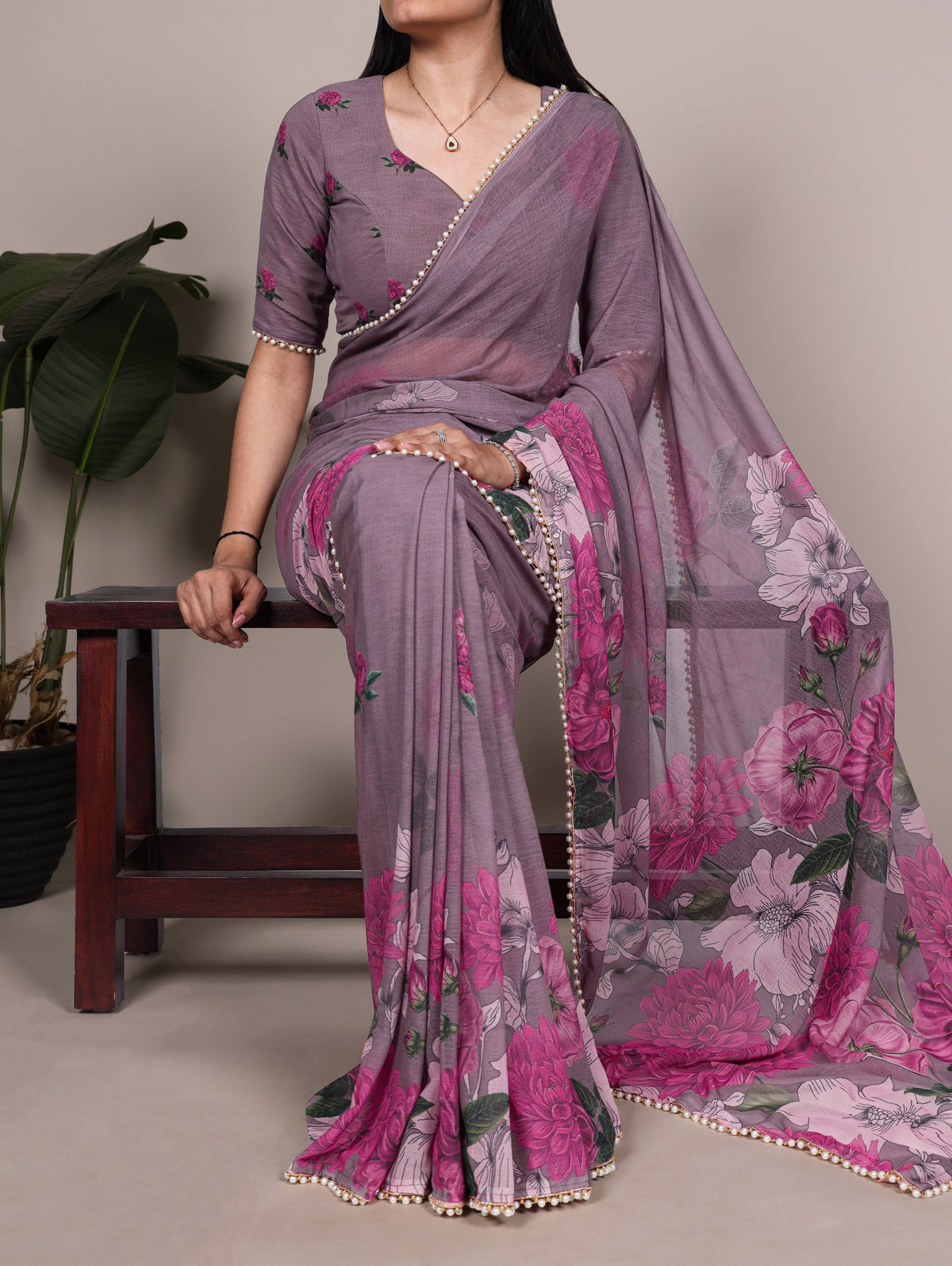 Gray printed saree styled to illustrate saree blouse back neck and closure planning