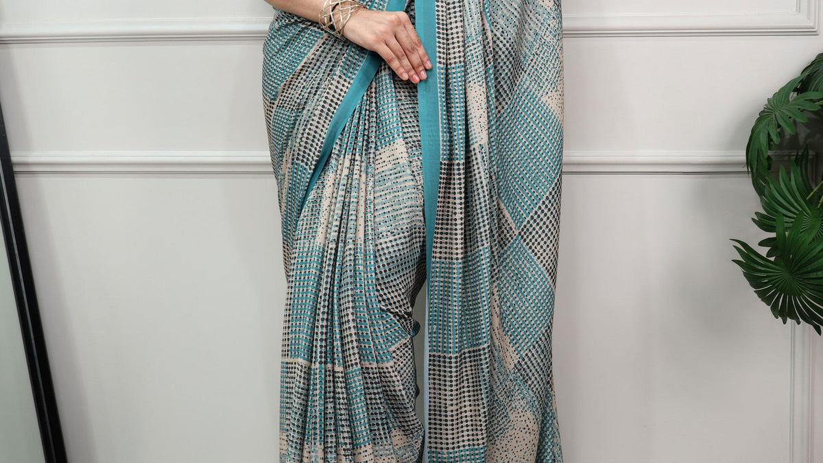Saree styling with flat footwear using a firozi printed satin silk saree from ClothsVilla