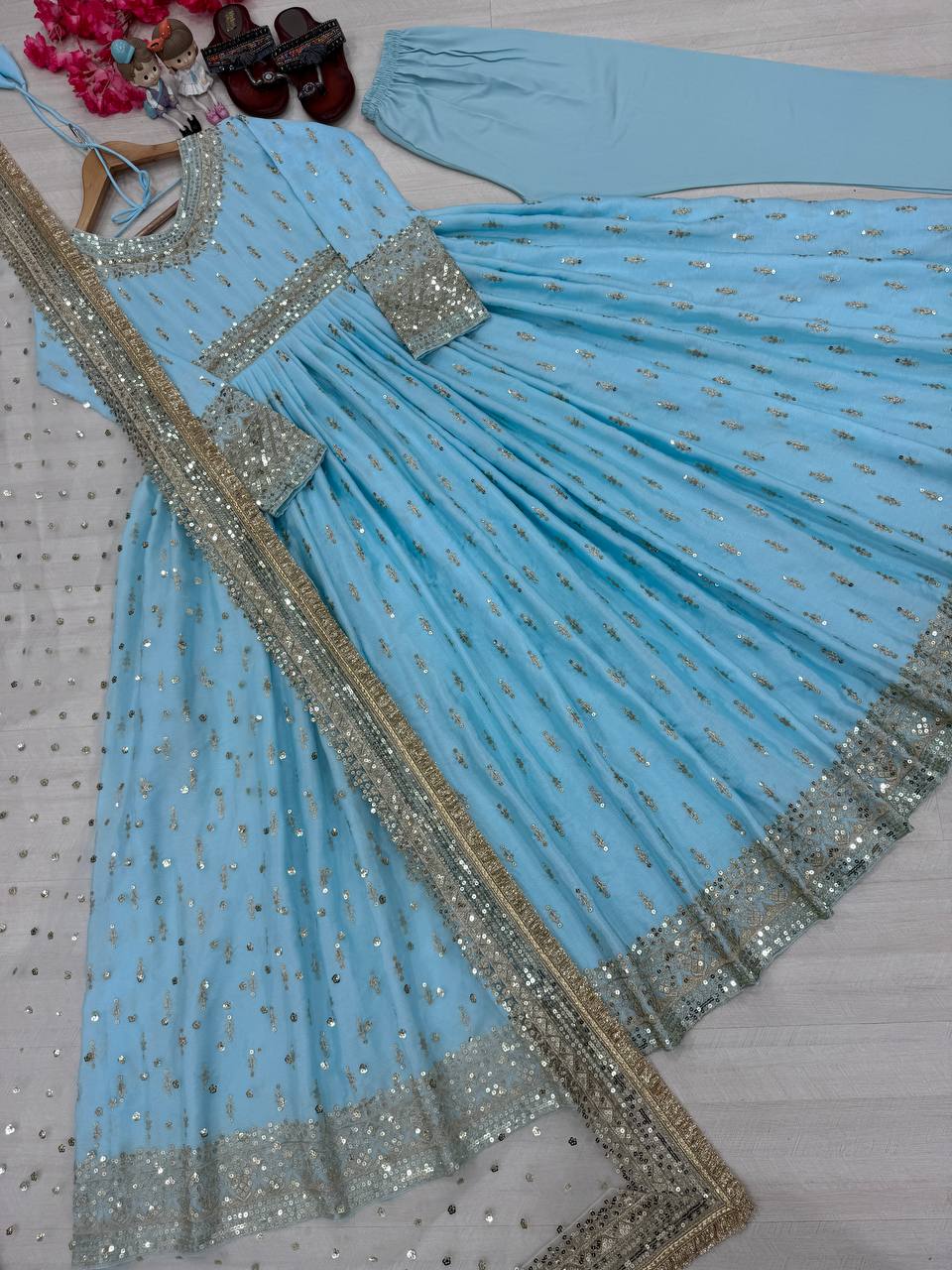 Sky blue embroidered ethnic gown for AI jewellery, hairstyle and dupatta styling prompts