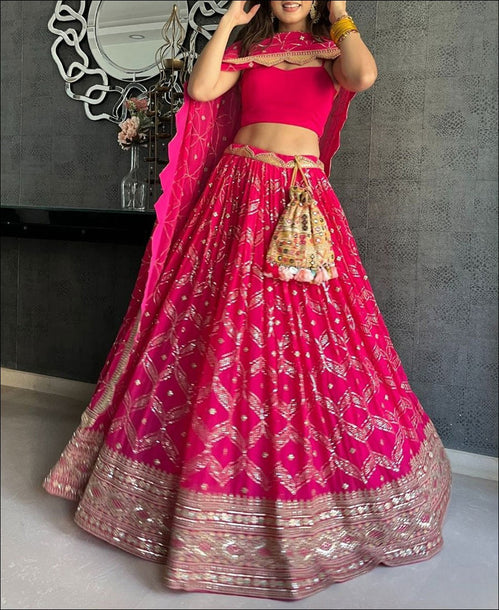 Radiant Elegance: Unveiling the Dark Pink Georgette Lehenga Choli with Exquisite Coding and Sequence Work - ClothsVilla.com