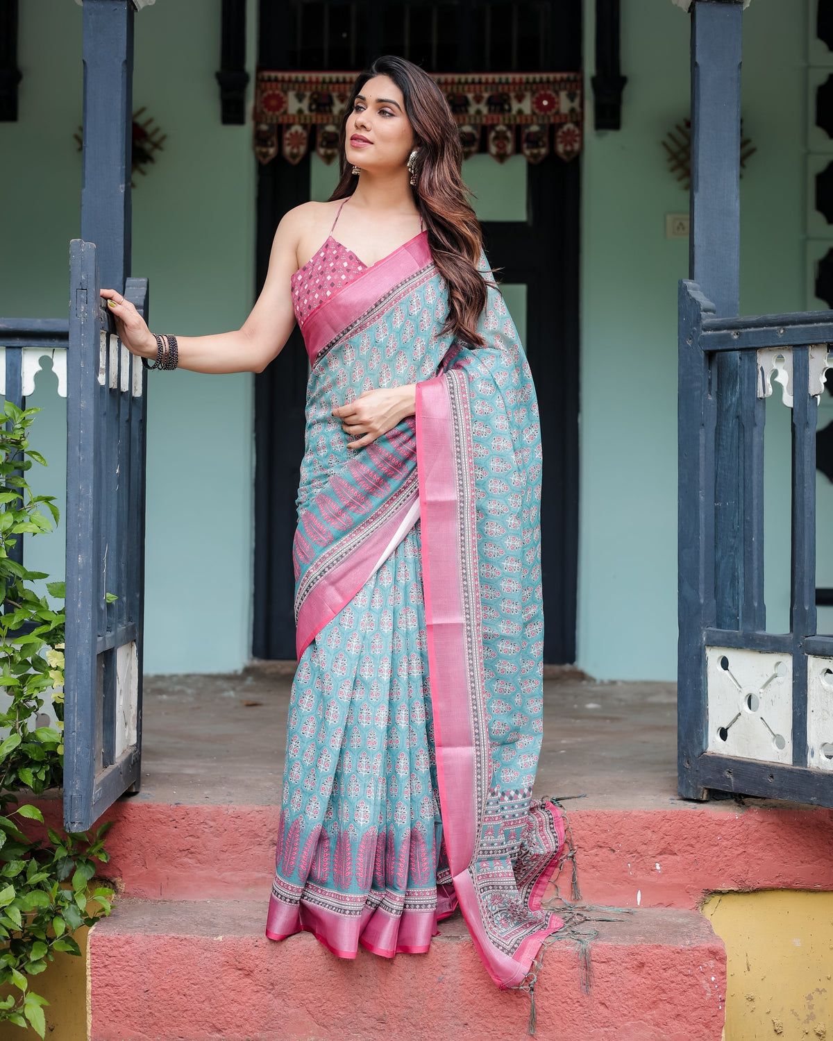 Aqua Blue Pure Cotton Linen Saree with Pink Border, Floral Motifs, and Tassel Detailing LINEN Main image