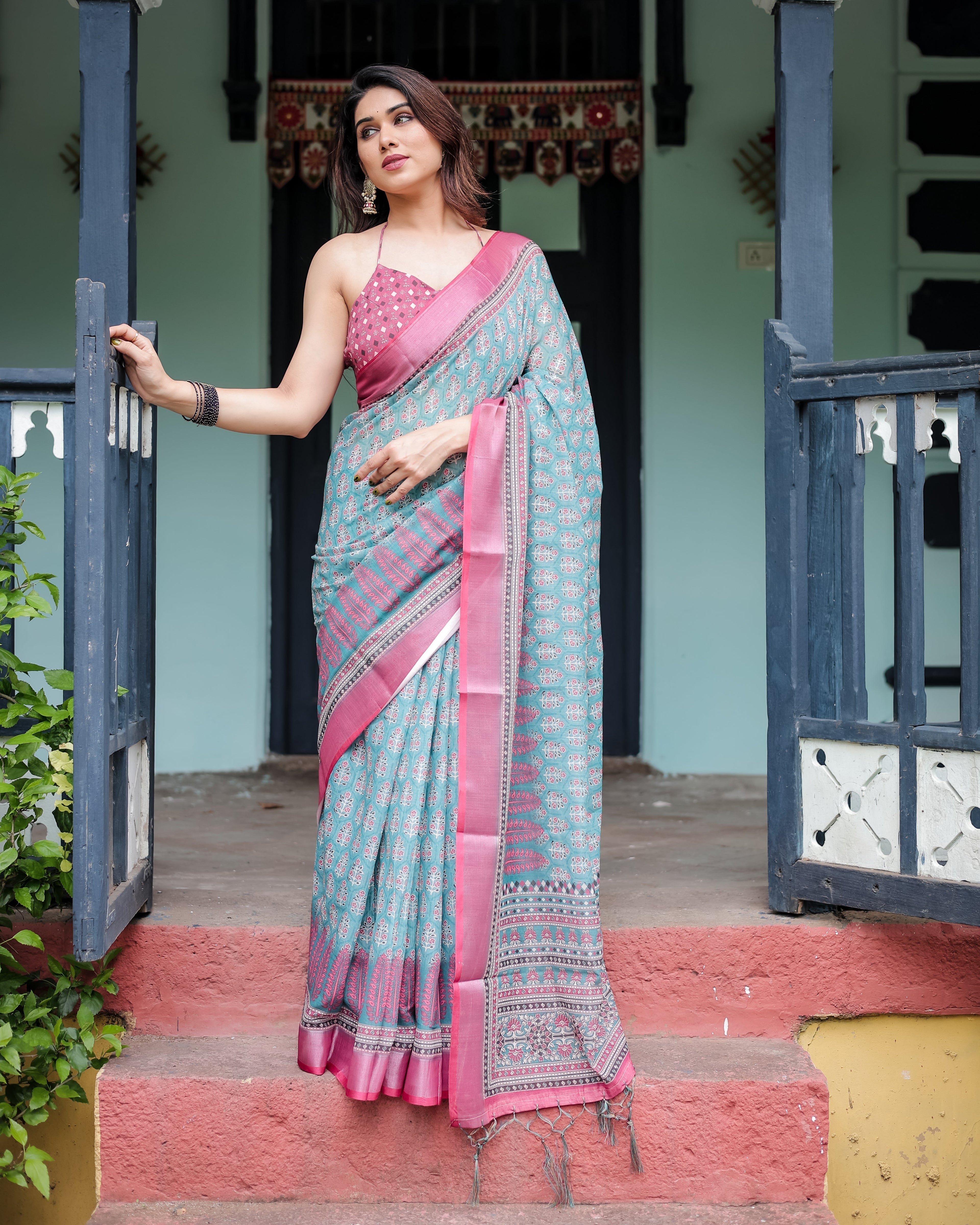 Aqua Blue Pure Cotton Linen Saree with Pink Border, Floral Motifs, and Tassel Detailing LINEN