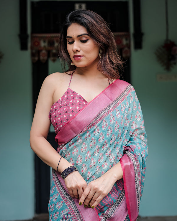 Aqua Blue Pure Cotton Linen Saree with Pink Border, Floral Motifs, and Tassel Detailing LINEN
