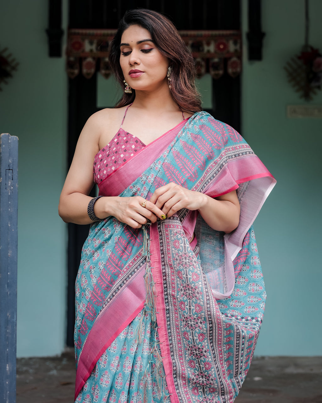 Aqua Blue Pure Cotton Linen Saree with Pink Border, Floral Motifs, and Tassel Detailing LINEN