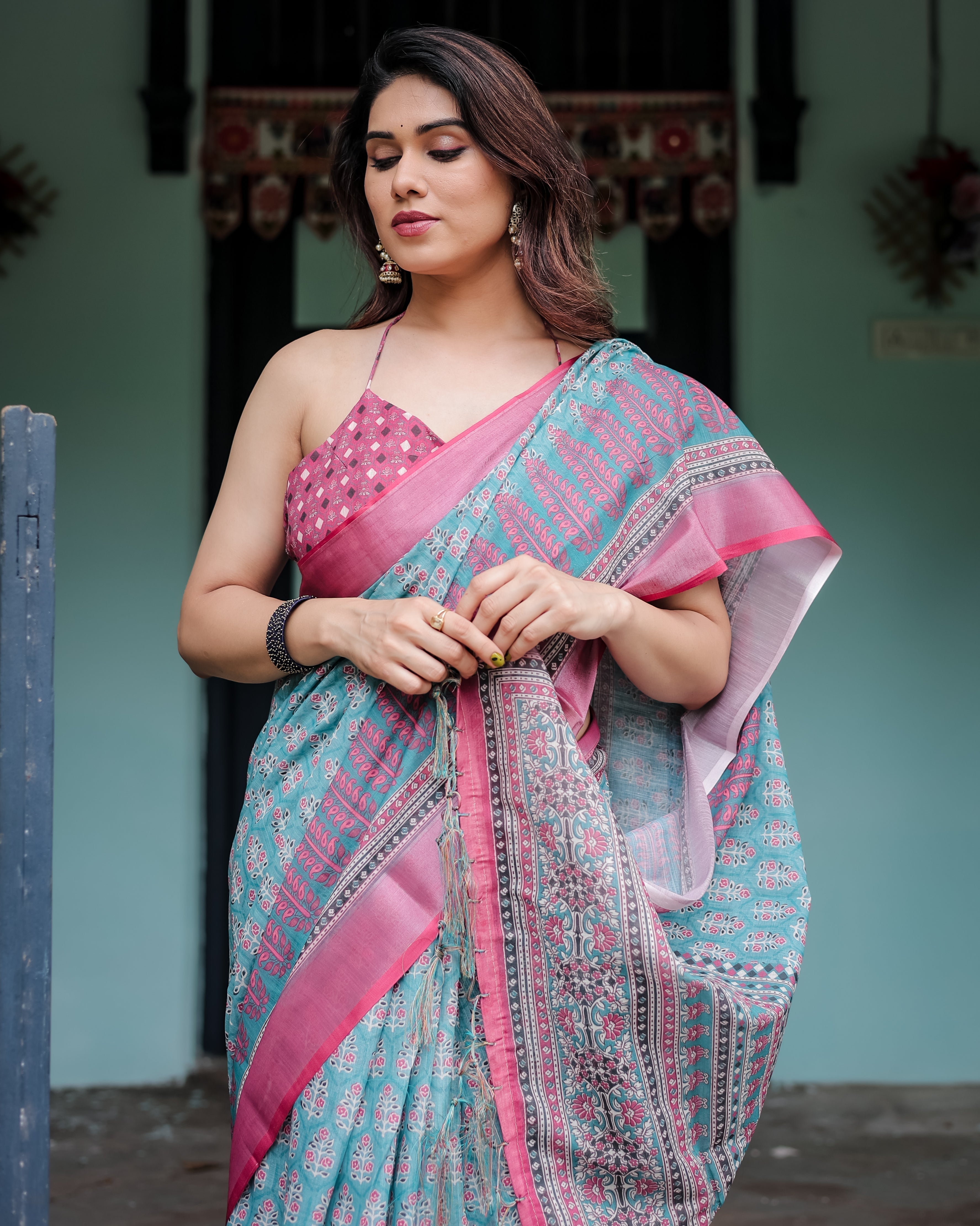 Aqua Blue Pure Cotton Linen Saree with Pink Border, Floral Motifs, and Tassel Detailing LINEN