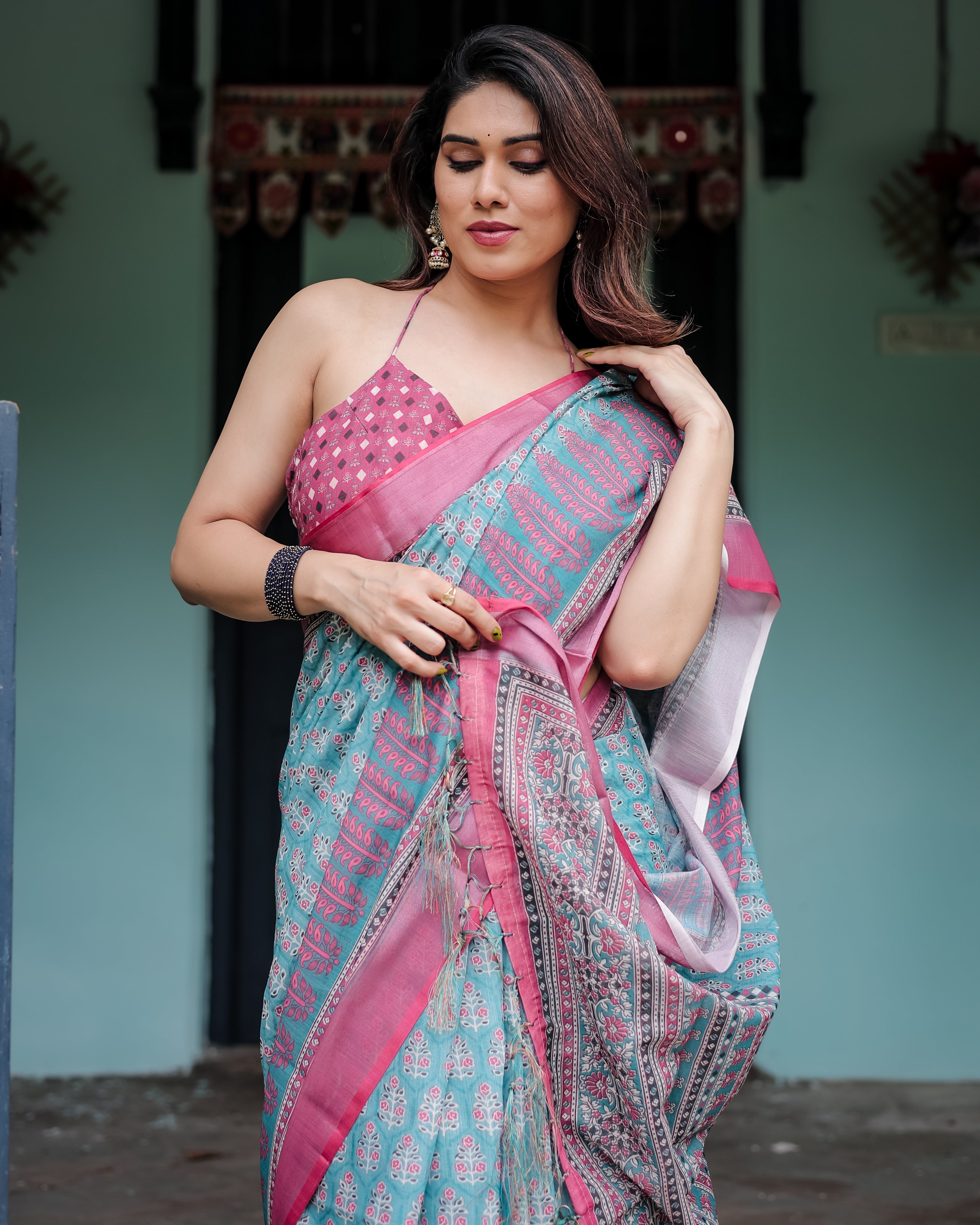 Aqua Blue Pure Cotton Linen Saree with Pink Border, Floral Motifs, and Tassel Detailing LINEN