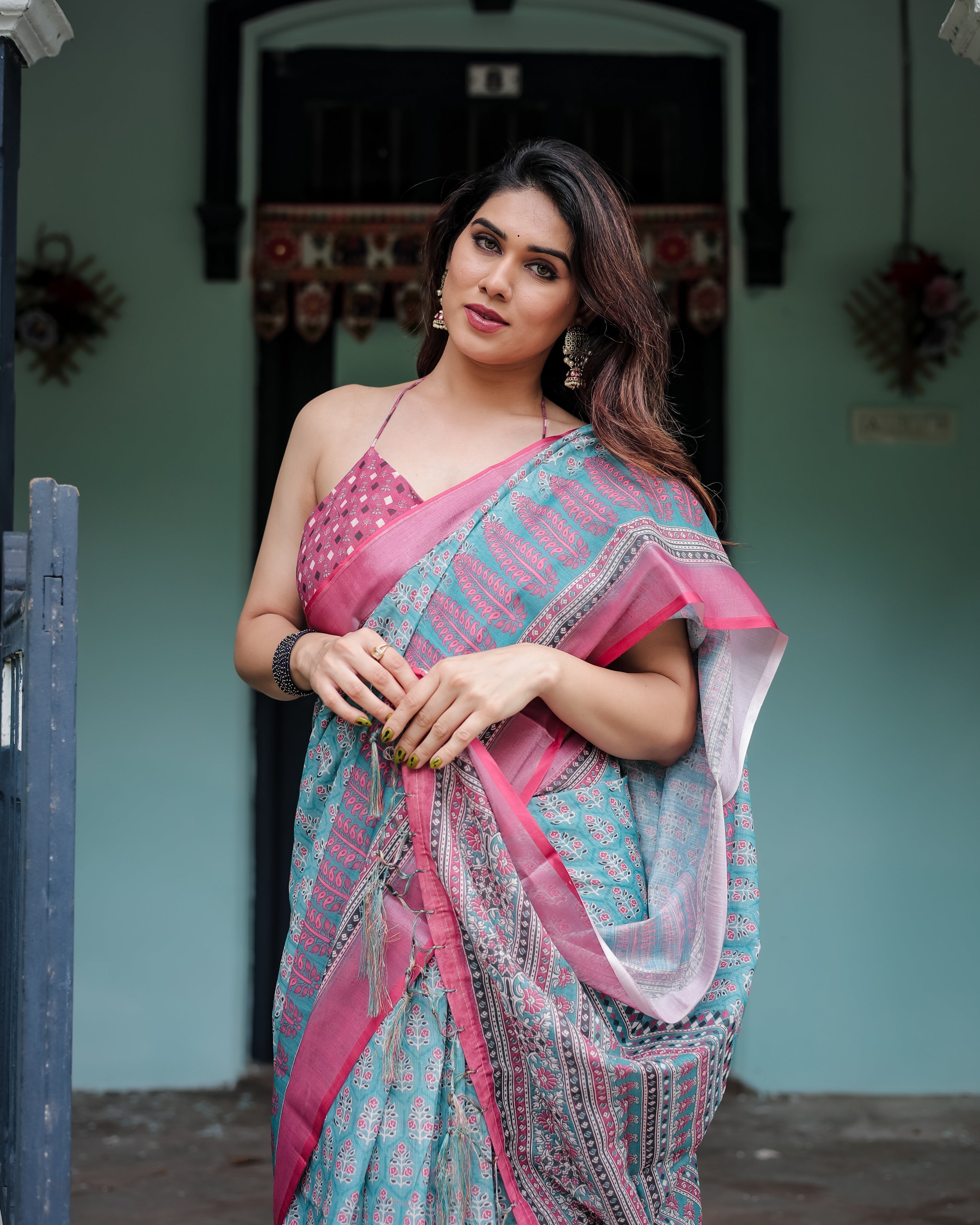 Aqua Blue Pure Cotton Linen Saree with Pink Border, Floral Motifs, and Tassel Detailing LINEN