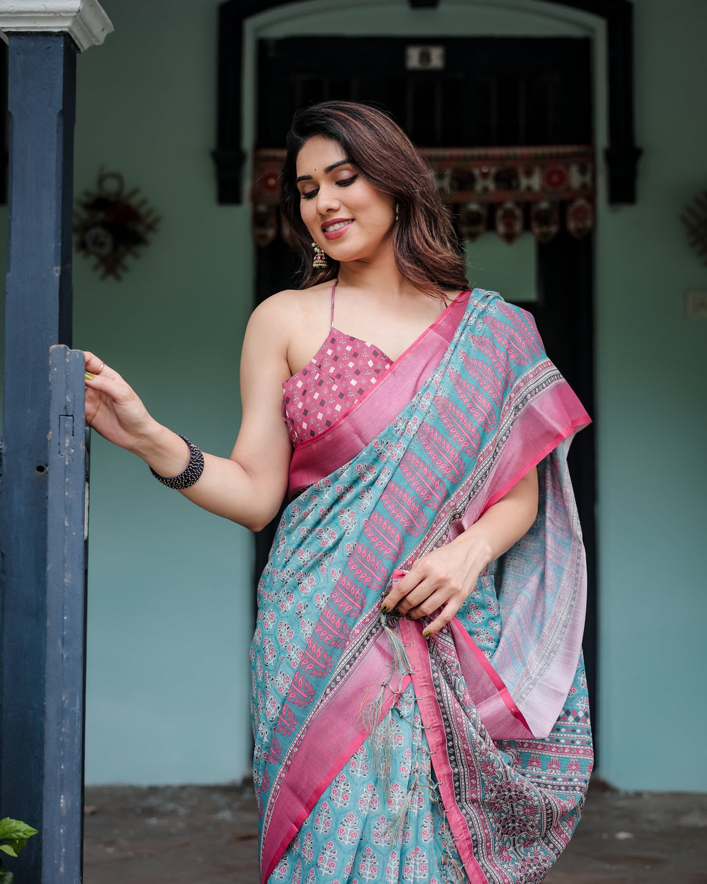 Aqua Blue Pure Cotton Linen Saree with Pink Border, Floral Motifs, and Tassel Detailing LINEN