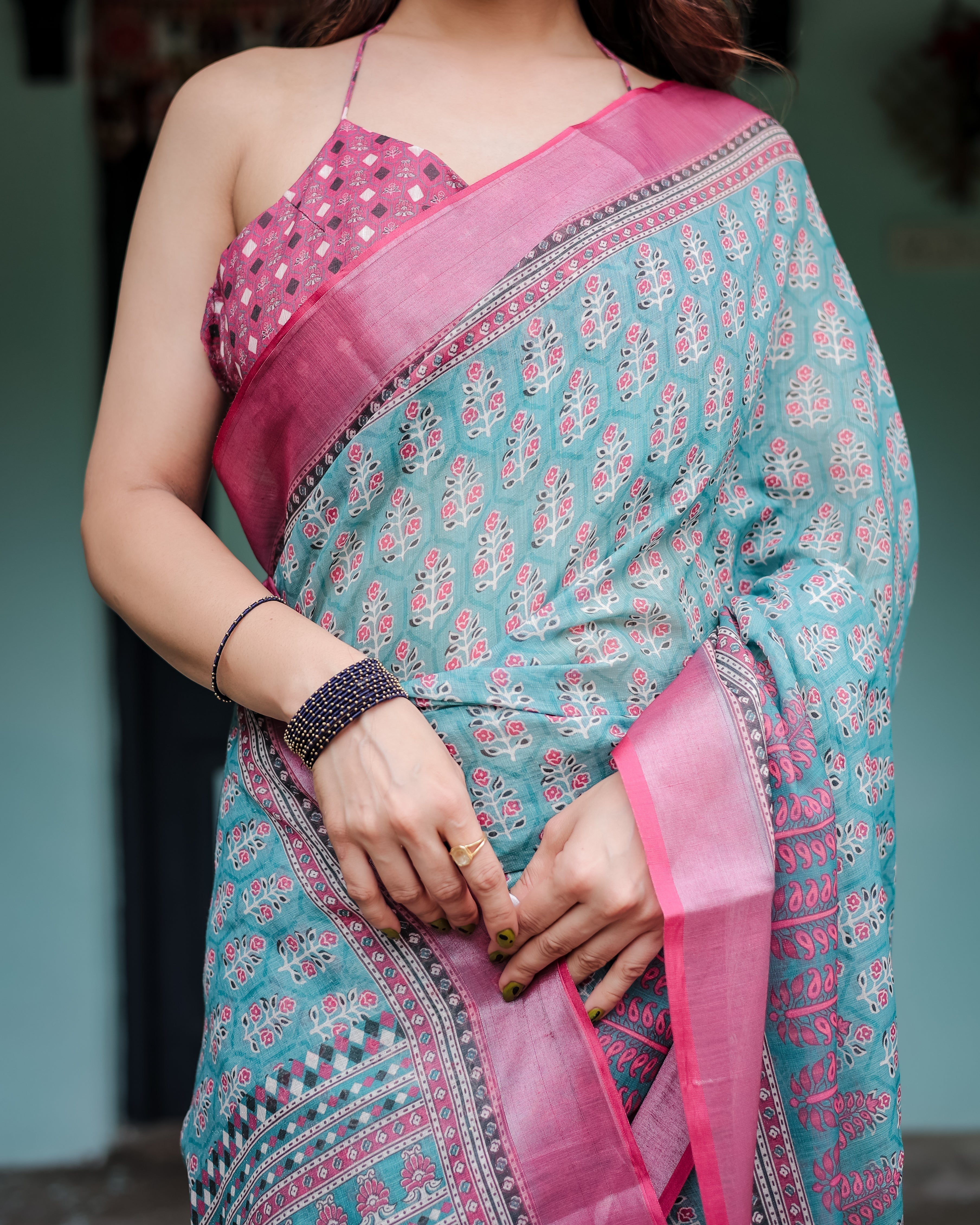 Aqua Blue Pure Cotton Linen Saree with Pink Border, Floral Motifs, and Tassel Detailing LINEN