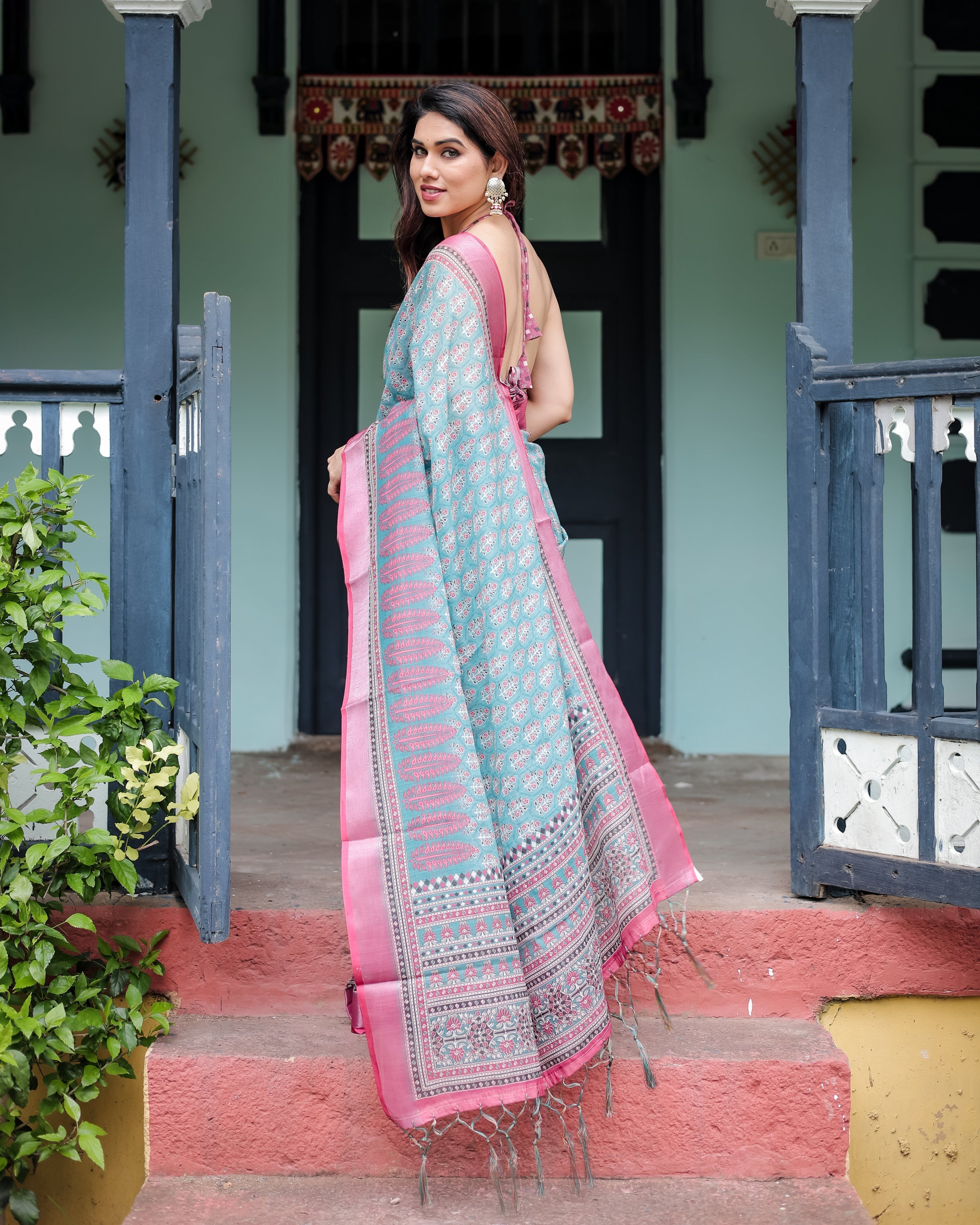 Aqua Blue Pure Cotton Linen Saree with Pink Border, Floral Motifs, and Tassel Detailing LINEN
