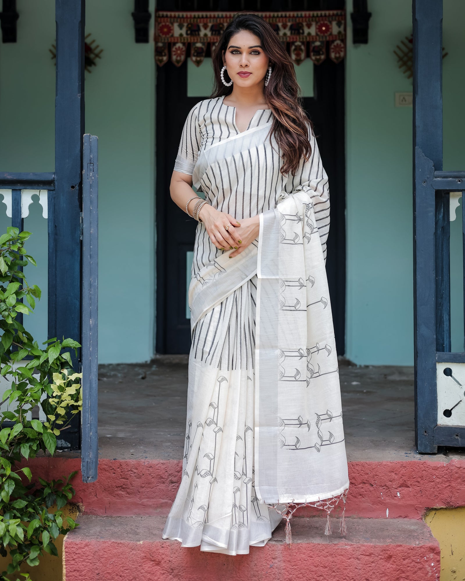 White and Black Pure Cotton Linen Saree with Striped Pattern, Blouse, and Tassel Detailing LINEN