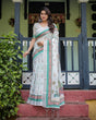 Load image into Gallery viewer, Ivory Pure Cotton Linen Saree with Elephant Motif and Floral Pattern, Green and Pink Borders, and Tassels on Edges. LINEN