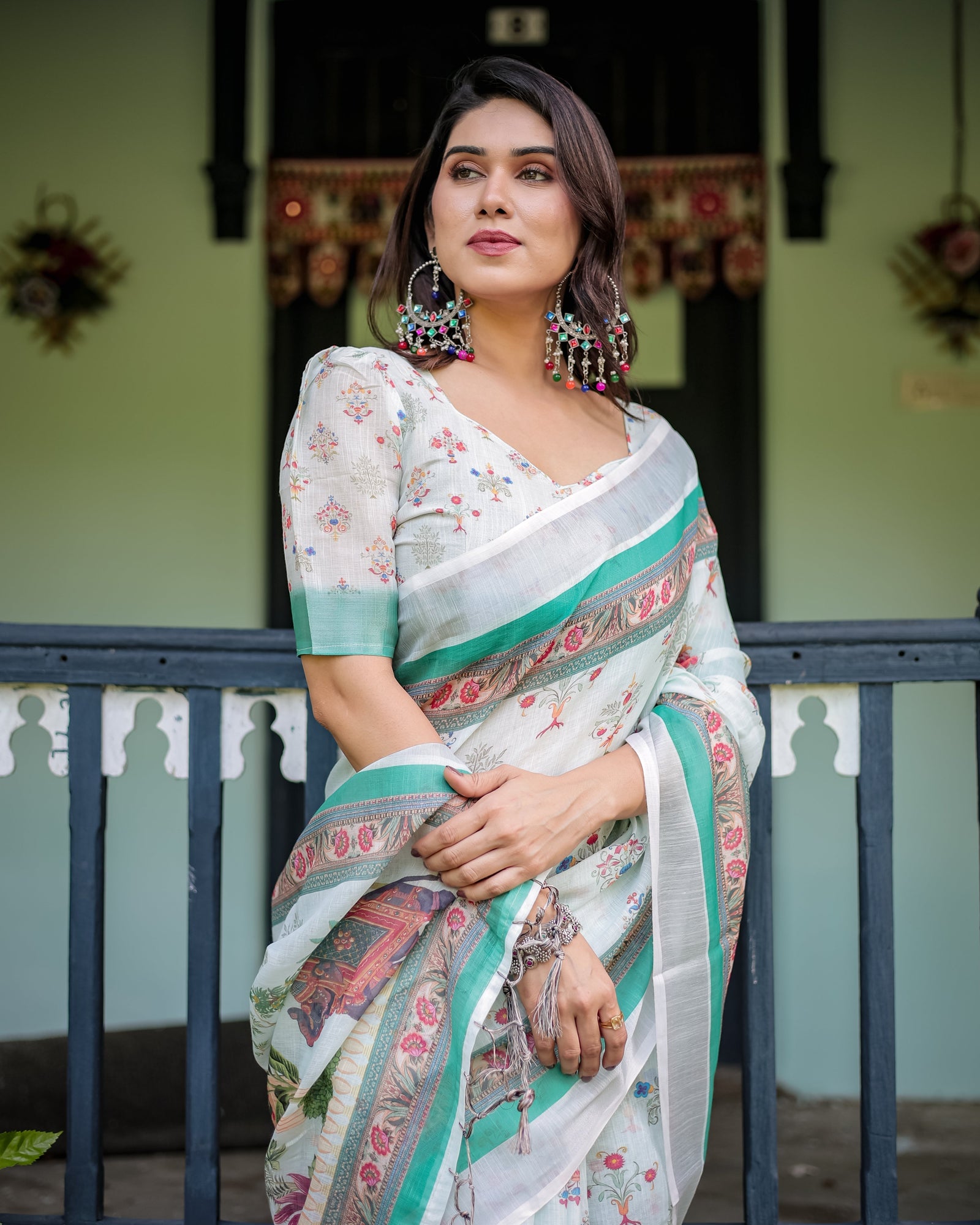 Ivory Pure Cotton Linen Saree with Elephant Motif and Floral Pattern, Green and Pink Borders, and Tassels on Edges. LINEN