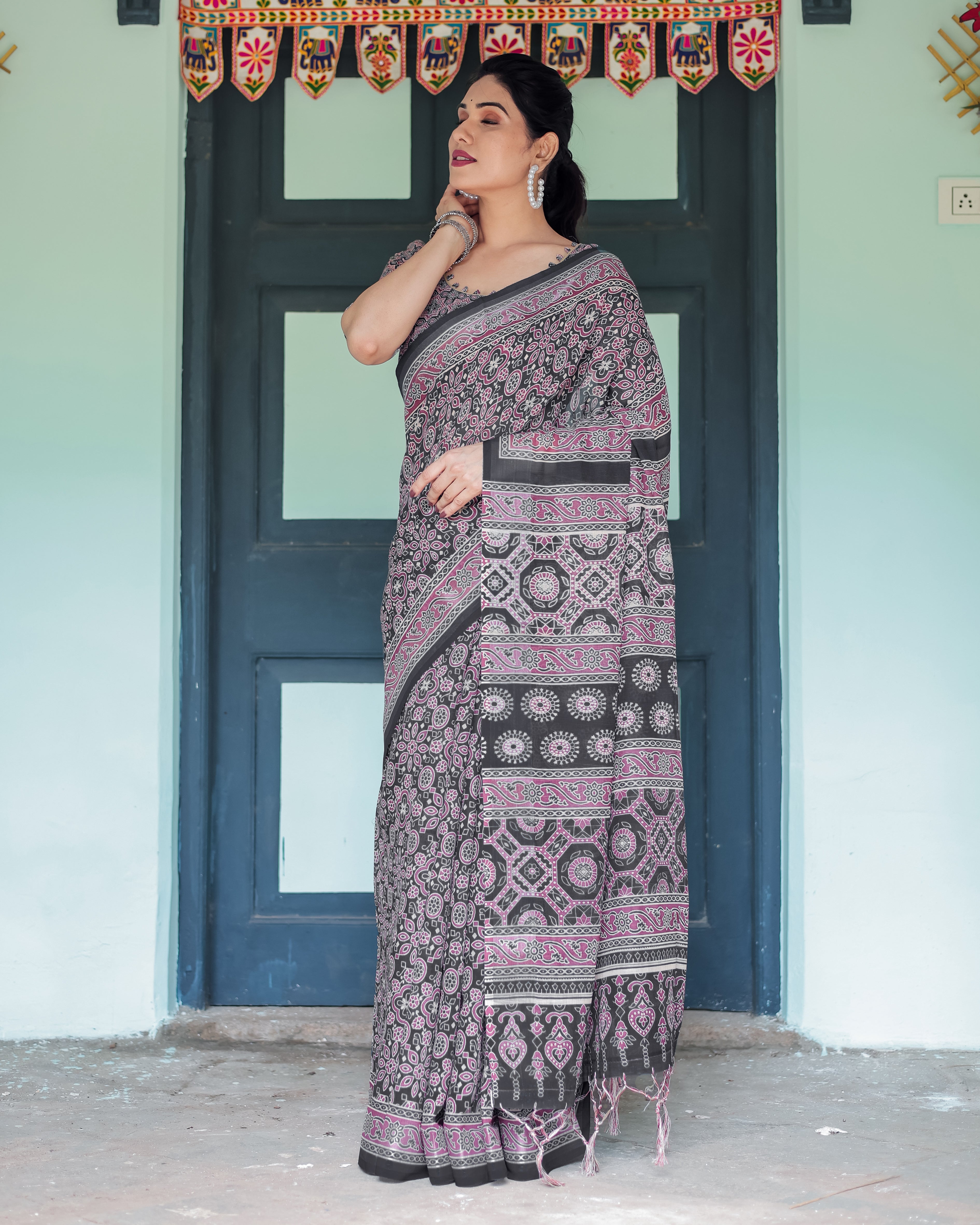 Black Pure Cotton Linen Saree with Pink Striped Pallu and Tassel Accents Secondary image