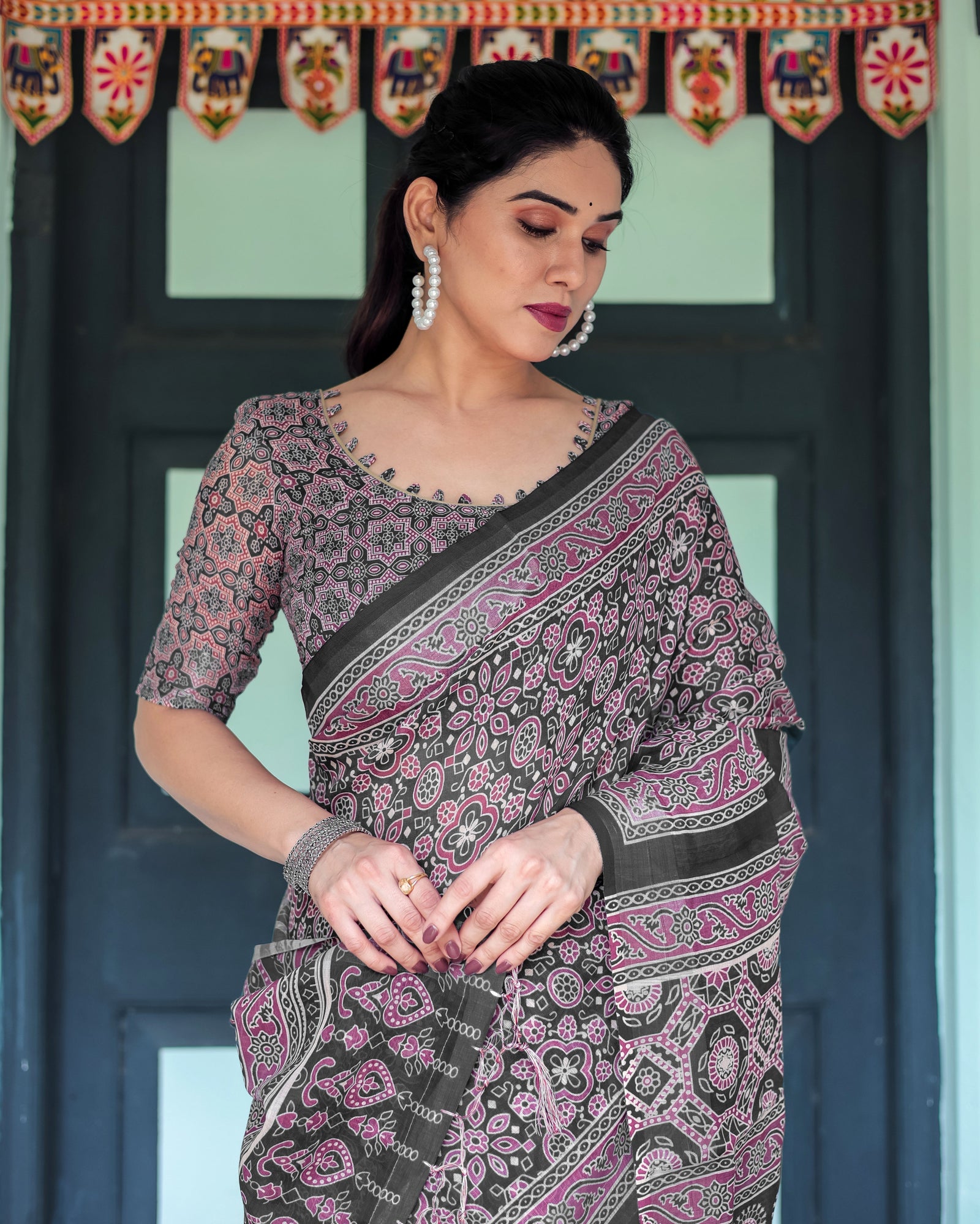 Black Pure Cotton Linen Saree with Pink Striped Pallu and Tassel Accents LINEN