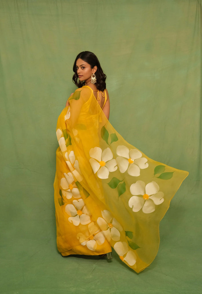 Sunshine Yellow Pure Organza Saree with Hand-Painted White Floral Motifs & Sequin Embellishments FANCY SAREES