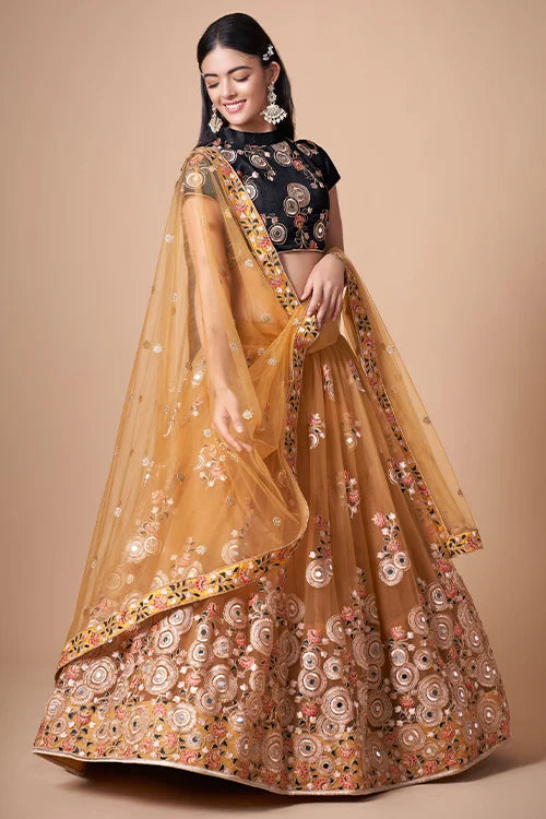 Gold Color Exquisite Soft Net Embellished Lehenga Choli For Festive Fervor Clothsvilla