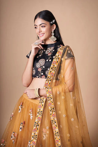 Gold Color Exquisite Soft Net Embellished Lehenga Choli For Festive Fervor Clothsvilla