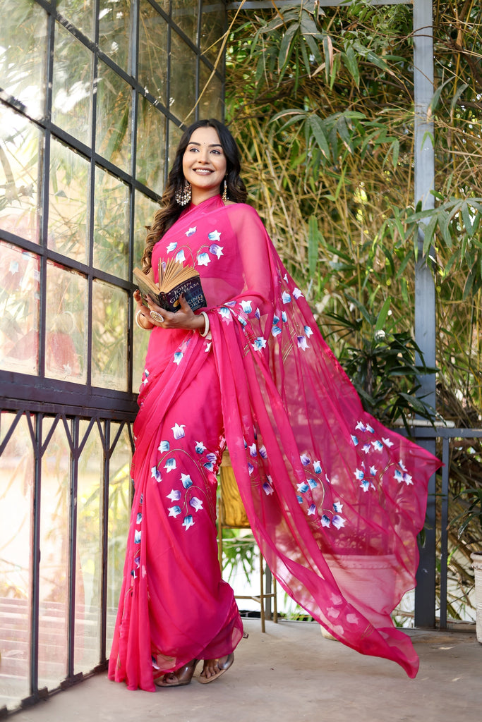 Rani Pink Georgette Saree with Hand-Painted Blue & White Bell Flowers – Attached Blouse – 5.5 Meters FANCY SAREES