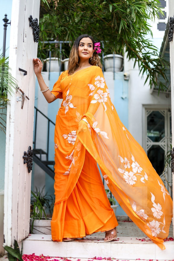 Sunset Orange Georgette Saree with Hand-Painted White Floral Motifs – Attached Blouse – 5.5 Meters FANCY SAREES