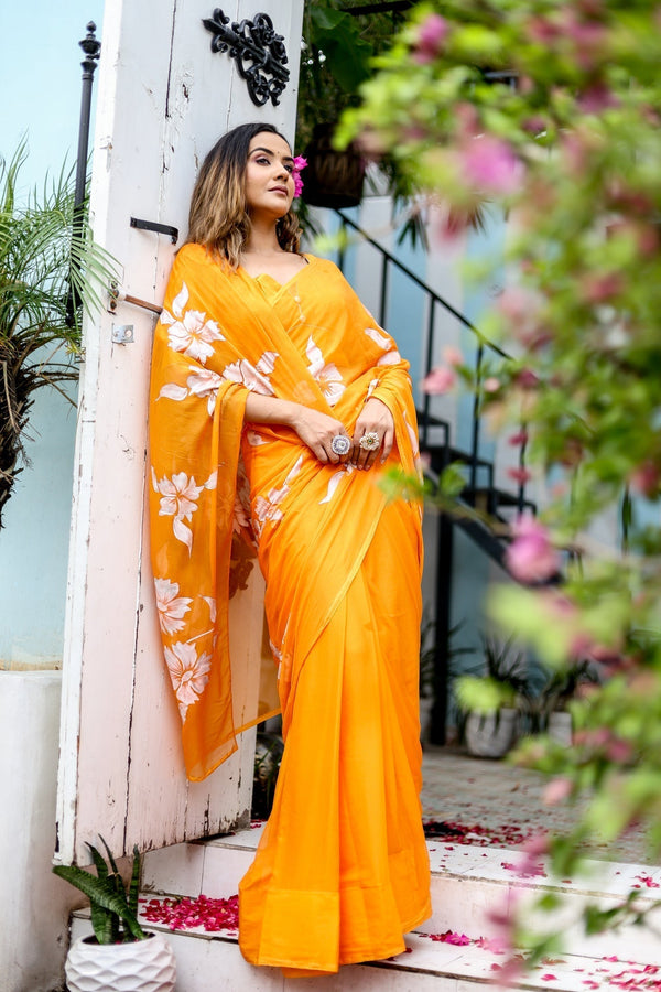 Sunset Orange Georgette Saree with Hand-Painted White Floral Motifs – Attached Blouse – 5.5 Meters FANCY SAREES
