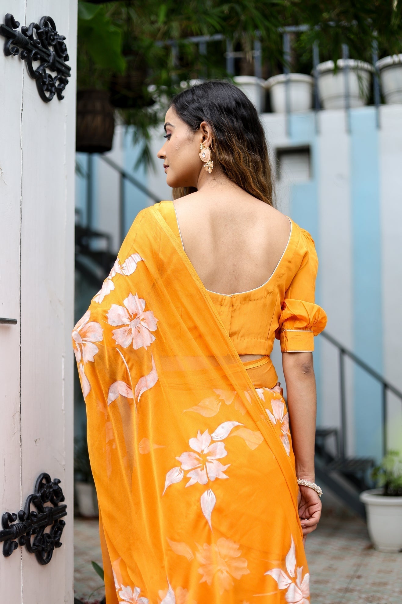 Sunset Orange Georgette Saree with Hand-Painted White Floral Motifs – Attached Blouse – 5.5 Meters FANCY SAREES