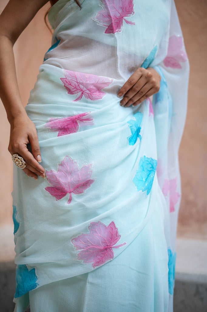Sky Blue Georgette Saree with Embroidered Pink & Blue Leaf Motifs – Attached Blouse – 5.5 Meters FANCY SAREES