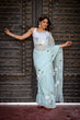 Load image into Gallery viewer, Pastel Blue Georgette Saree with Hand-Painted White Floral Motifs &amp; Green Leaves – Attached Blouse – 5.5 Meters FANCY SAREES
