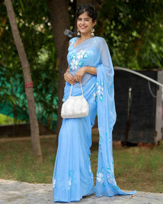 Sky Blue Georgette Saree with Hand-Painted White Floral Motifs – Attached Blouse – 5.5 Meters FANCY SAREES