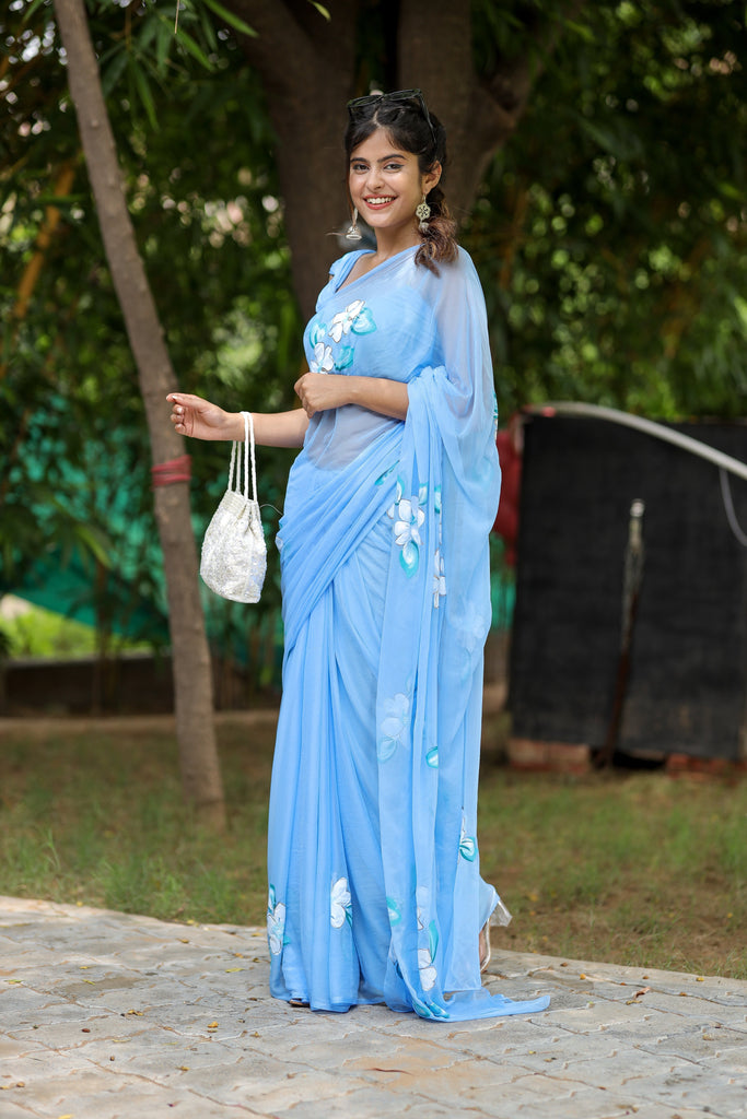 Sky Blue Georgette Saree with Hand-Painted White Floral Motifs – Attached Blouse – 5.5 Meters FANCY SAREES