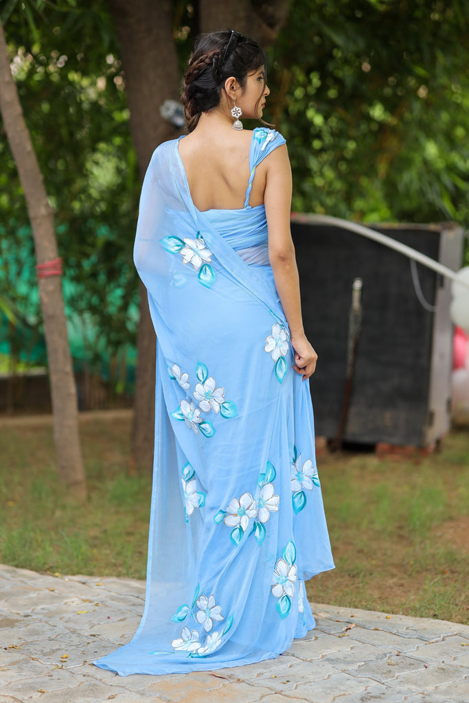 Sky Blue Georgette Saree with Hand-Painted White Floral Motifs – Attached Blouse – 5.5 Meters FANCY SAREES