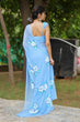 Load image into Gallery viewer, Sky Blue Georgette Saree with Hand-Painted White Floral Motifs – Attached Blouse – 5.5 Meters FANCY SAREES