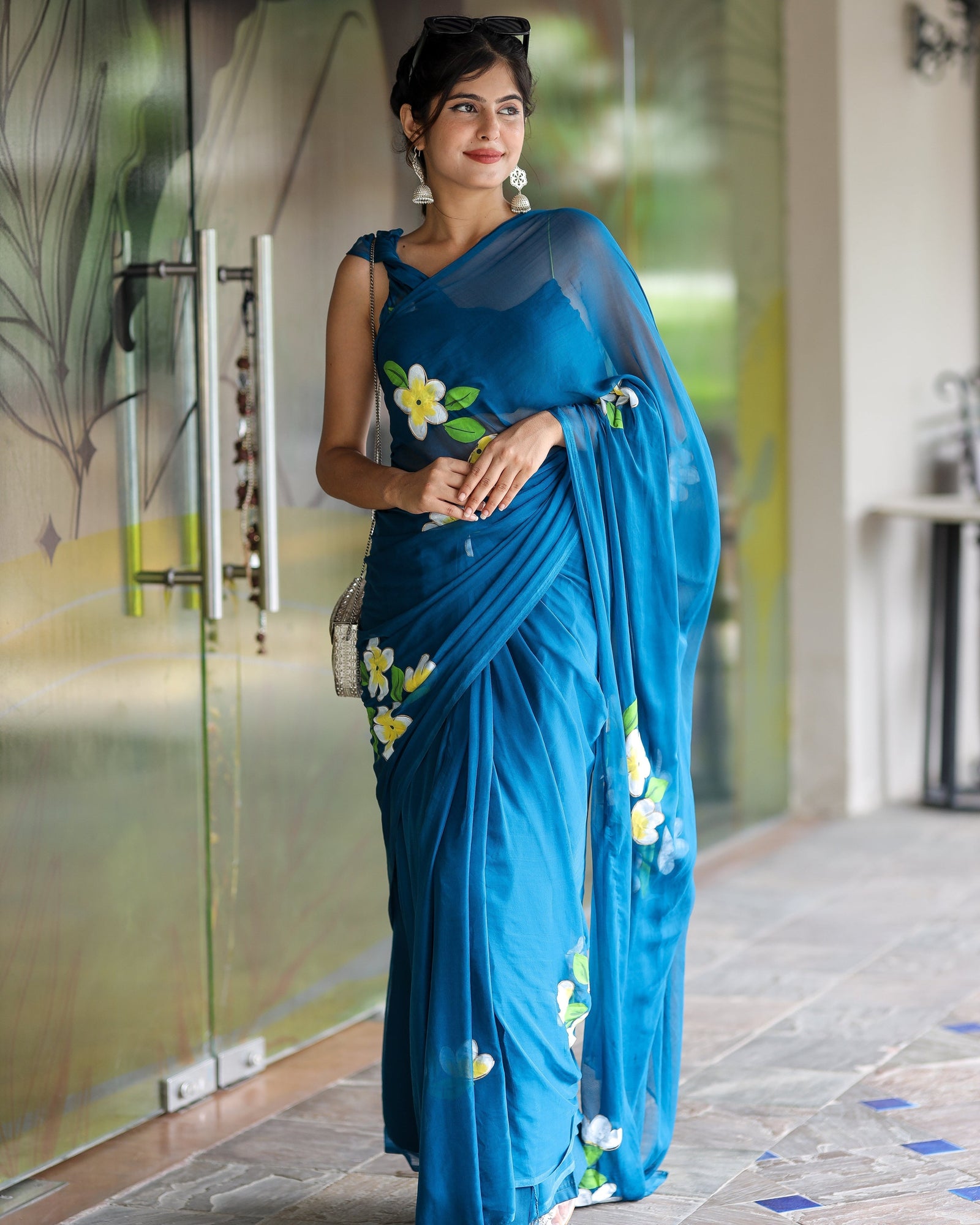 Teal Blue Georgette Saree with Hand-Painted Yellow & White Floral Motifs – Attached Blouse – 5.5 Meters FANCY SAREES