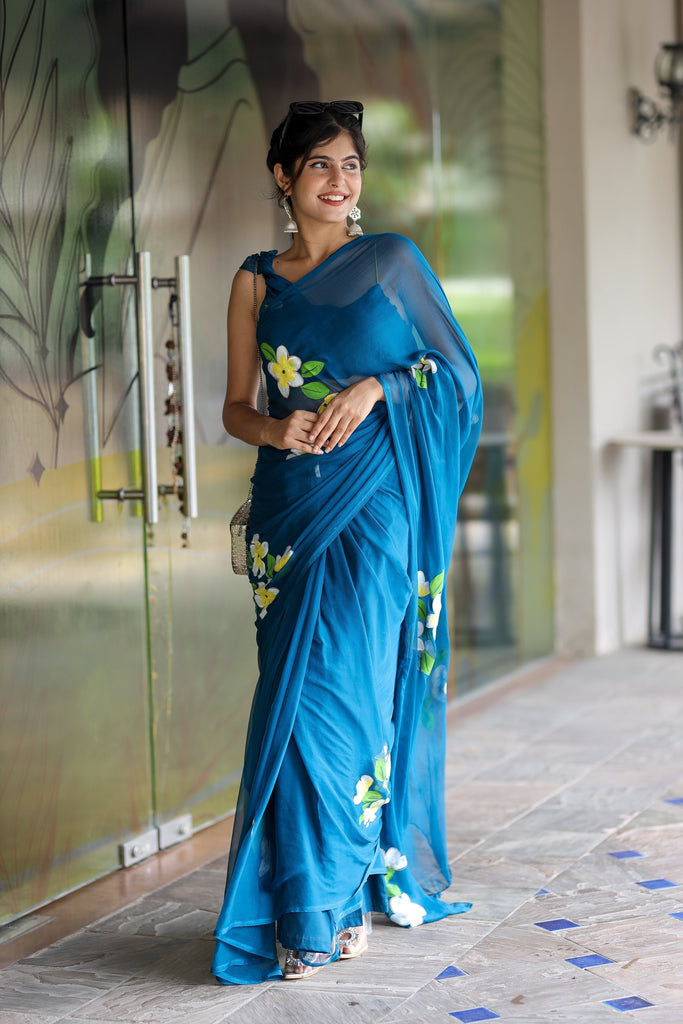 Teal Blue Georgette Saree with Hand-Painted Yellow & White Floral Motifs – Attached Blouse – 5.5 Meters FANCY SAREES
