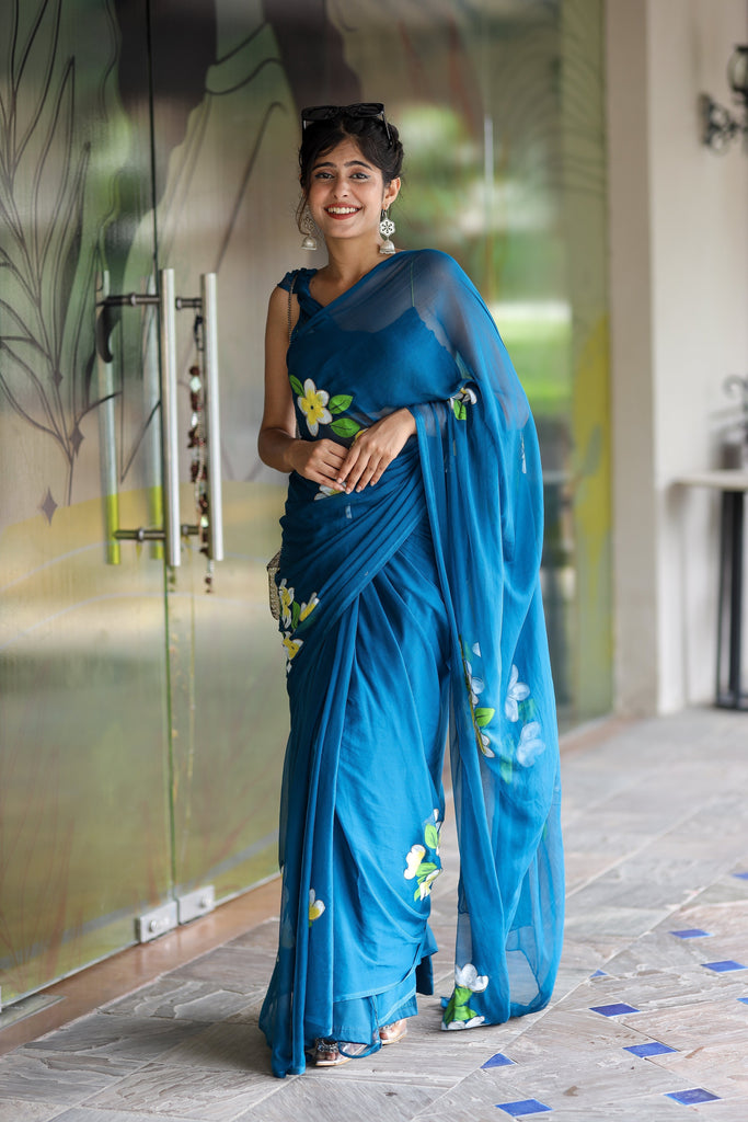 Teal Blue Georgette Saree with Hand-Painted Yellow & White Floral Motifs – Attached Blouse – 5.5 Meters FANCY SAREES