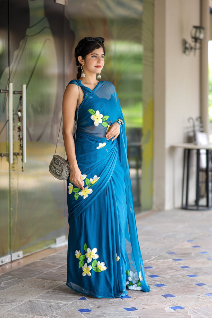 Teal Blue Georgette Saree with Hand-Painted Yellow & White Floral Motifs – Attached Blouse – 5.5 Meters FANCY SAREES