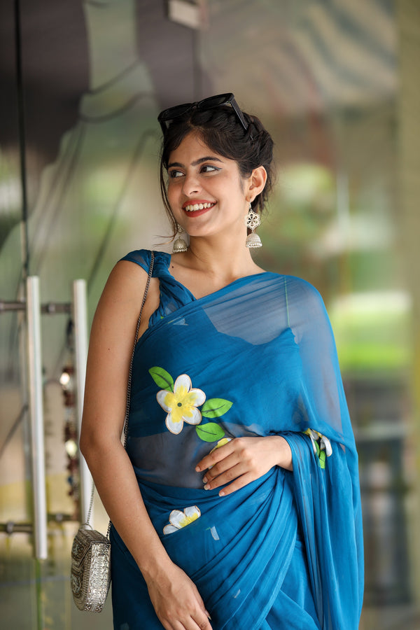 Teal Blue Georgette Saree with Hand-Painted Yellow & White Floral Motifs – Attached Blouse – 5.5 Meters FANCY SAREES