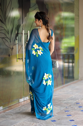 Teal Blue Georgette Saree with Hand-Painted Yellow & White Floral Motifs – Attached Blouse – 5.5 Meters FANCY SAREES