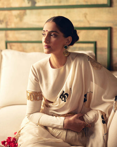 SONAM KAPOOR In Cream Satin Georgette Saree with Golden and Black Calligraphy Print FANCY SAREES