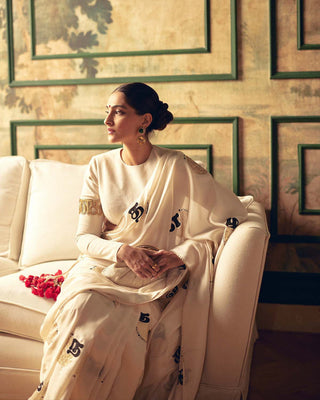 SONAM KAPOOR In Cream Satin Georgette Saree with Golden and Black Calligraphy Print FANCY SAREES