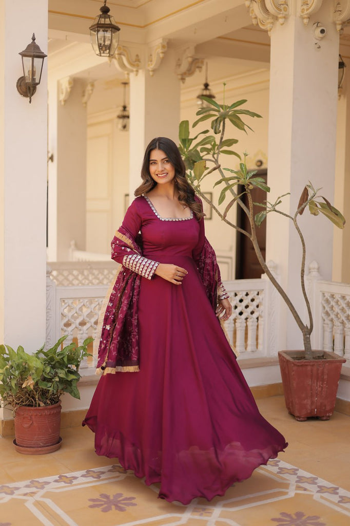 Embrace timeless elegance with our meticulously crafted Vichitra silk Magenta Pink gown and dupatta set. ClothsVilla