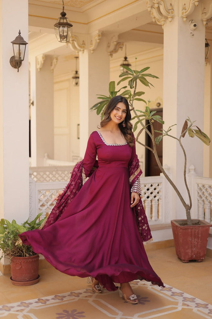 Embrace timeless elegance with our meticulously crafted Vichitra silk Magenta Pink gown and dupatta set. ClothsVilla