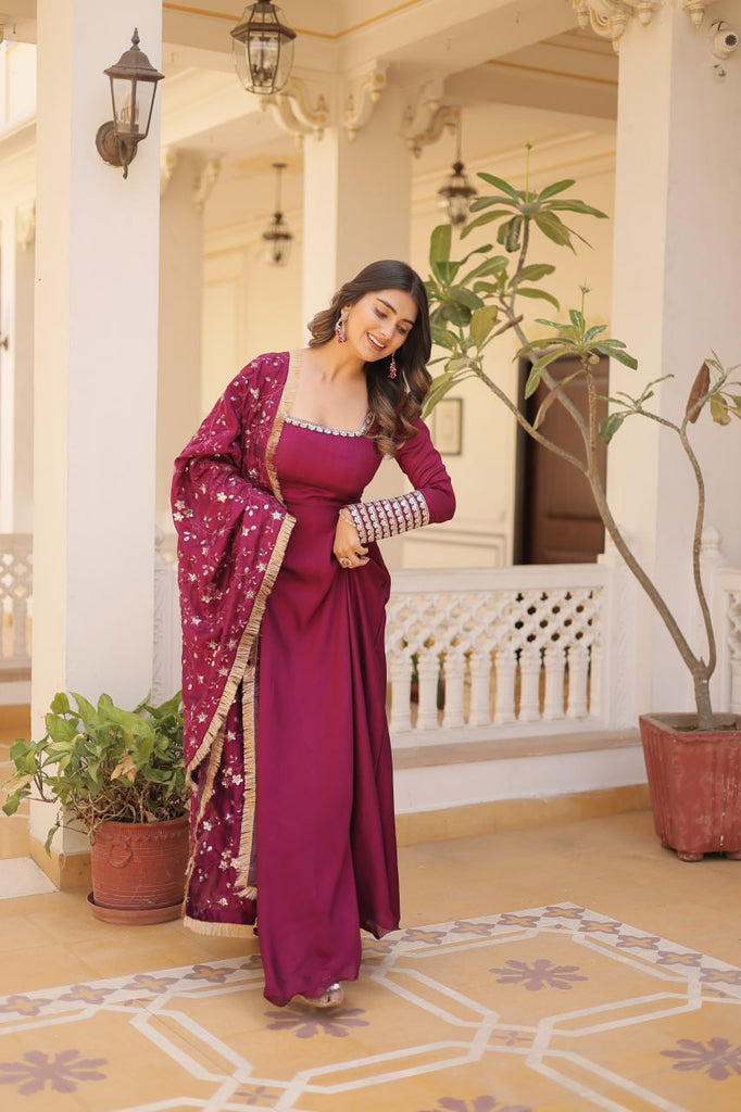 Embrace timeless elegance with our meticulously crafted Vichitra silk Magenta Pink gown and dupatta set. ClothsVilla