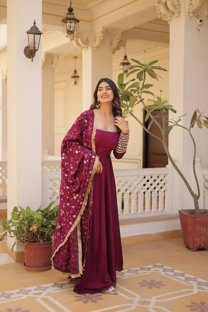 Embrace timeless elegance with our meticulously crafted Vichitra silk Magenta Pink gown and dupatta set. ClothsVilla