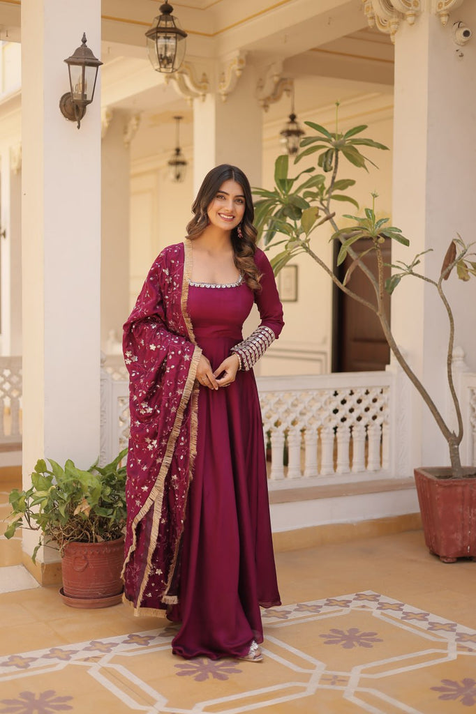 Embrace timeless elegance with our meticulously crafted Vichitra silk Magenta Pink gown and dupatta set. ClothsVilla