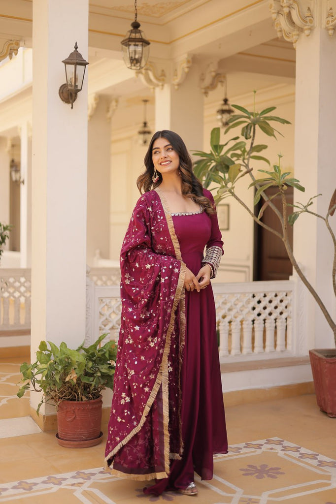 Embrace timeless elegance with our meticulously crafted Vichitra silk Magenta Pink gown and dupatta set. ClothsVilla