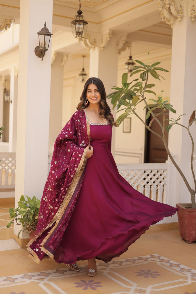 Embrace timeless elegance with our meticulously crafted Vichitra silk Magenta Pink gown and dupatta set. ClothsVilla