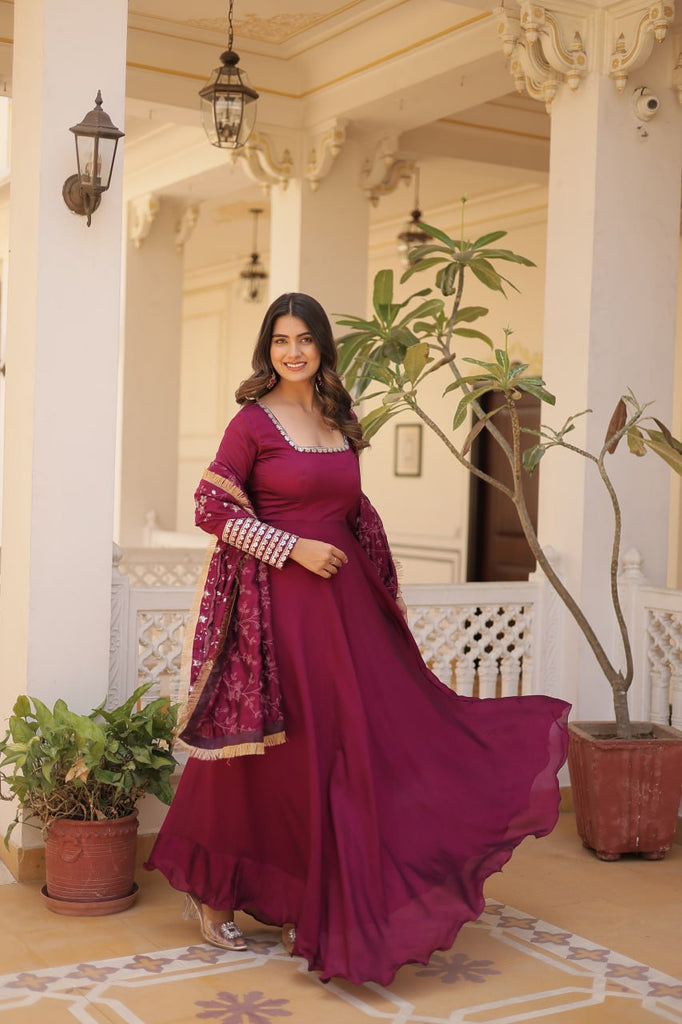 Embrace timeless elegance with our meticulously crafted Vichitra silk Magenta Pink gown and dupatta set. ClothsVilla